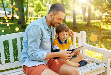 Image showing father and son with tablet pc computer at park