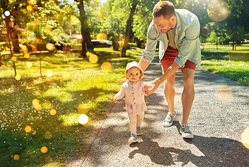 Image showing happy father with baby daughter walking at park