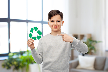 Image showing smiling boy showing green recycling sign