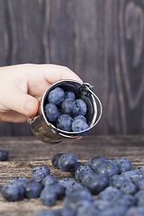 Image showing small decorative bucket and berries