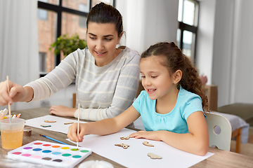 Image showing happy mother with little daughter drawing at home