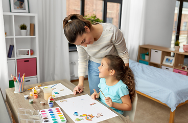 Image showing mother with little daughter drawing at home