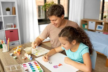 Image showing happy father with little daughter drawing at home