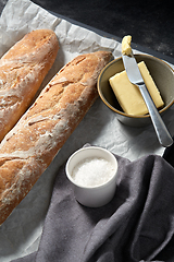 Image showing close up of bread, butter and knife on towel