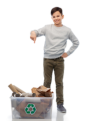 Image showing smiling boy sorting paper waste