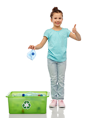 Image showing girl sorting plastic waste and showing thumbs up
