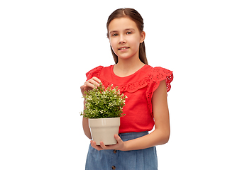 Image showing happy smiling girl holding flower in pot