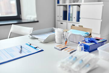 Image showing syringes and medicine on table at hospital