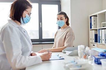 Image showing doctor with clipboard and patient at hospital