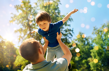 Image showing happy father with son playing in summer park