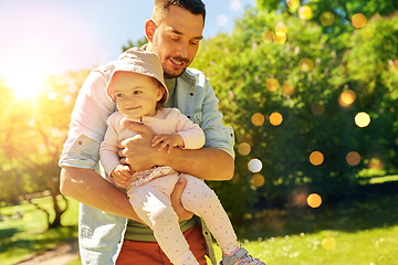 Image showing happy father with baby daughter at summer park