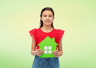 Image showing smiling little girl holding green house icon