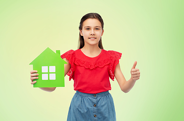 Image showing happy girl with green house icon showing thumbs up