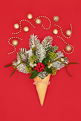 Image showing Surreal Christmas Ice Cream Cone with  Flora and Gold Baubles