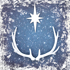 Image showing Christmas Reindeer Antlers with Star on Grunge Blue Background