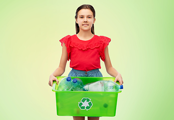 Image showing smiling girl sorting plastic waste over green