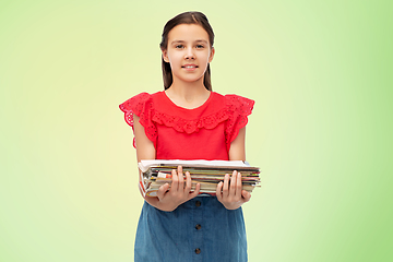 Image showing smiling girl with magazines sorting paper waste