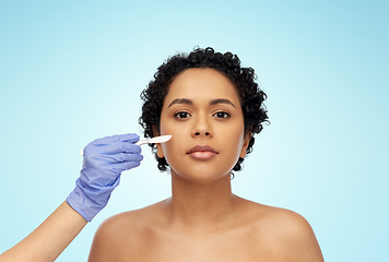 Image showing african american woman and hand with scalpel knife