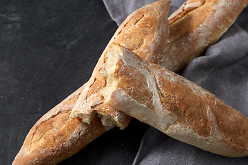 Image showing close up of baguette bread on kitchen towel