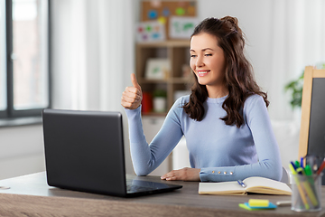 Image showing teacher with laptop having online class at home