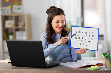 Image showing teacher with alphabet having online class at home