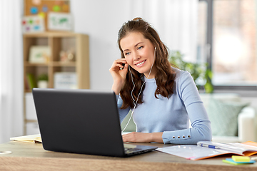 Image showing teacher with laptop having online class at home