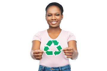 Image showing smiling asian woman holding green recycling sign