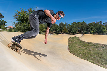 Image showing Skateboarder on a pump track park