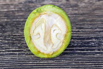 Image showing cut green walnut