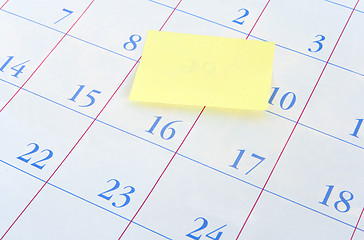 Image showing Yellow memo note on a calendar