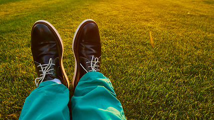 Image showing Man relaxing, enjoying landscape on sunny day - point of view