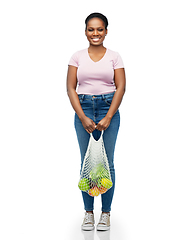 Image showing african woman with food in reusable string bag