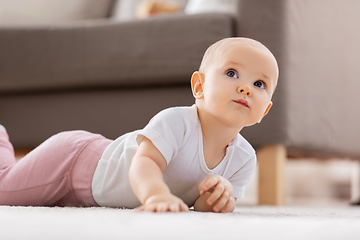 Image showing little baby girl crawling on floor at home