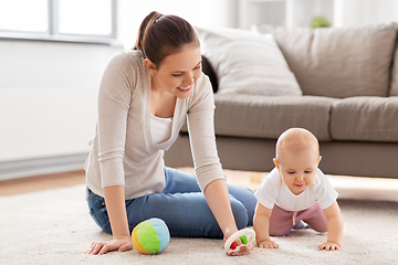 Image showing happy mother playing with little baby at home