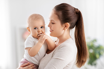 Image showing happy mother with little baby daughter at home