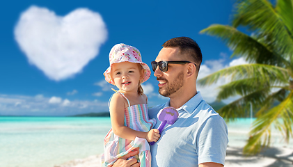 Image showing happy father with little daughter on beach