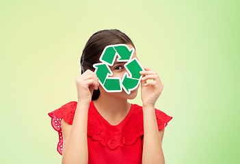 Image showing smiling girl holding green recycling sign