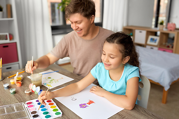 Image showing happy father with little daughter drawing at home