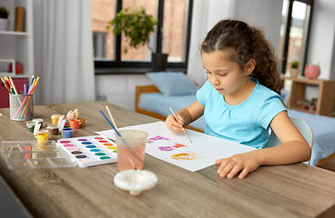 Image showing little girl with colors drawing picture at home