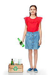 Image showing smiling girl with wooden box sorting glass waste