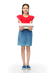 Image showing smiling girl with magazines sorting paper waste