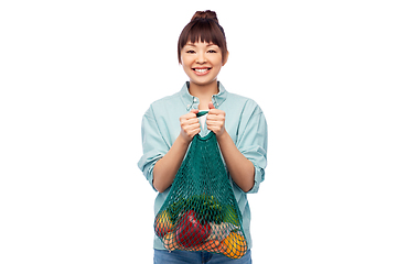 Image showing happy asian woman with food in reusable string bag