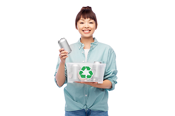 Image showing smiling young asian woman sorting metallic waste