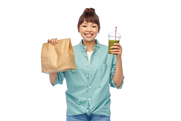 Image showing happy asian woman with drink and food in paper bag