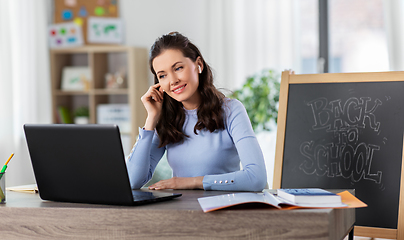 Image showing teacher with laptop having online class at home