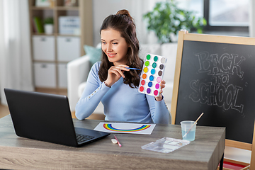 Image showing teacher with colors having online class of arts