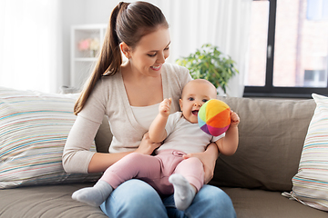 Image showing happy smiling mother with little baby at home