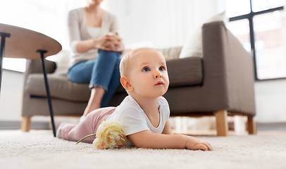 Image showing mother and baby crawling on floor at home