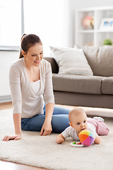 Image showing happy smiling mother with little baby at home