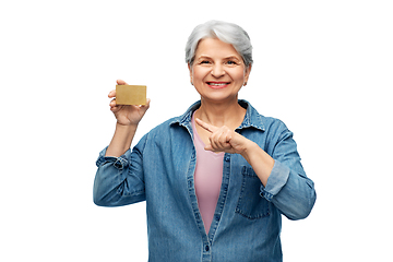 Image showing portrait of smiling senior woman with credit card